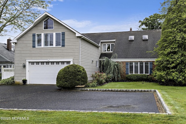 14 W St, Monmouth Beach, NJ 07750 - view of front of home featuring an attached garage, driveway, a front yard, and a shingled roof