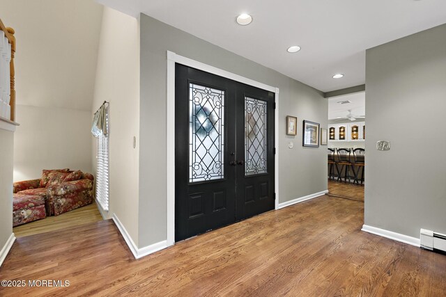 14 W St, Monmouth Beach, NJ 07750 - entrance foyer featuring light wood-style floors, recessed lighting, french doors, a baseboard radiator, and ceiling fan