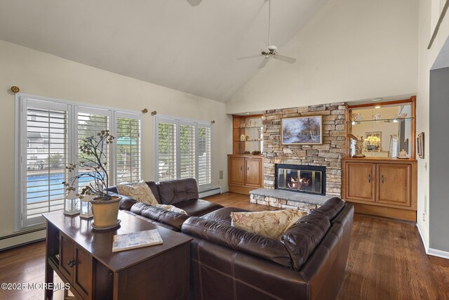14 W St, Monmouth Beach, NJ 07750 - living room with high vaulted ceiling, ceiling fan, a baseboard radiator, dark wood-style floors, and a fireplace