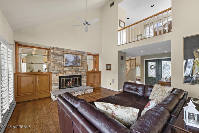 14 W St, Monmouth Beach, NJ 07750 - living area with dark wood-style floors, baseboard heating, stairway, ceiling fan, and high vaulted ceiling