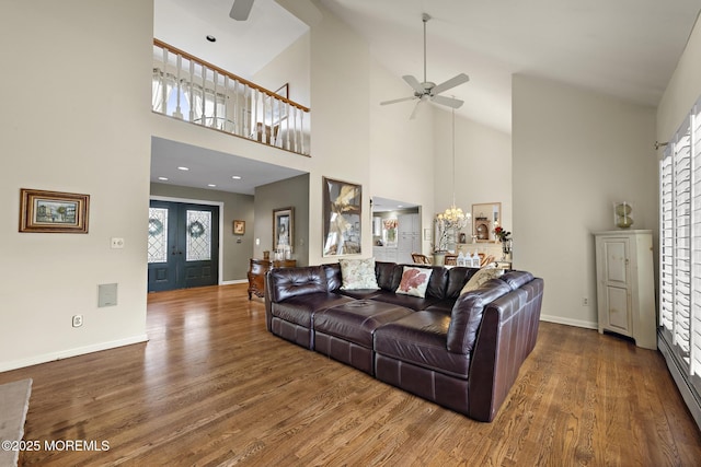 14 W St, Monmouth Beach, NJ 07750 - living room featuring a ceiling fan, wood finished floors, a towering ceiling, french doors, and a chandelier