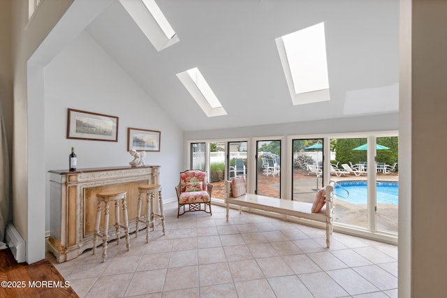 14 W St, Monmouth Beach, NJ 07750 - sitting room with a skylight, healthy amount of natural light, high vaulted ceiling, and light tile patterned floors