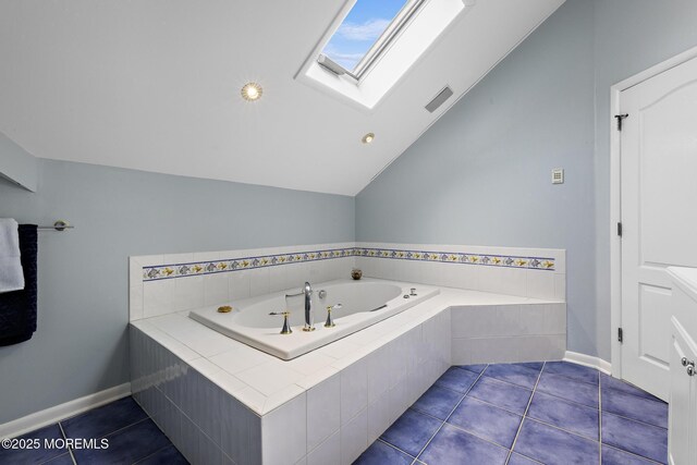 14 W St, Monmouth Beach, NJ 07750 - full bathroom with a garden tub, vaulted ceiling, a skylight, and tile patterned floors