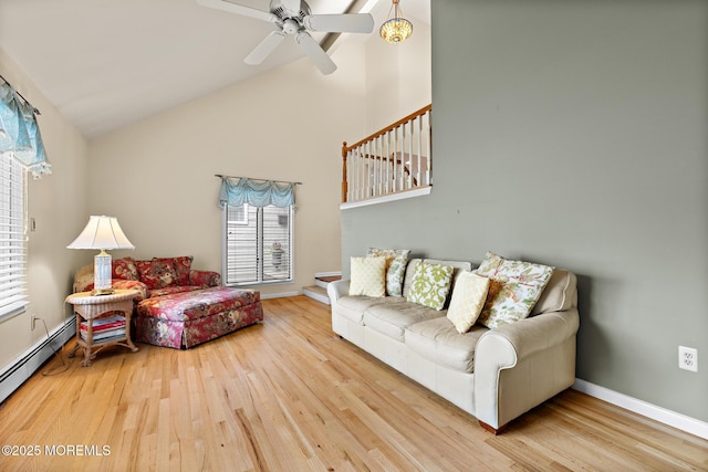 14 W St, Monmouth Beach, NJ 07750 - living room featuring baseboard heating, wood finished floors, high vaulted ceiling, and a ceiling fan
