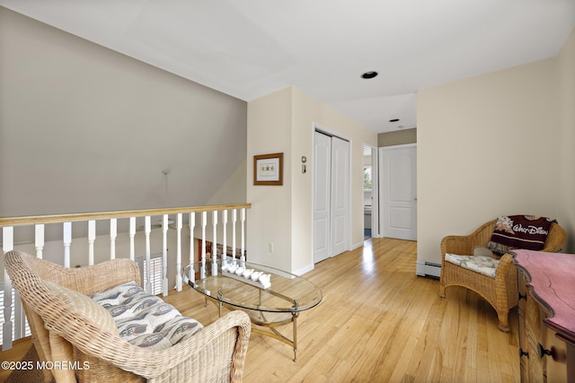 14 W St, Monmouth Beach, NJ 07750 - living area with a baseboard heating unit and light wood-style floors