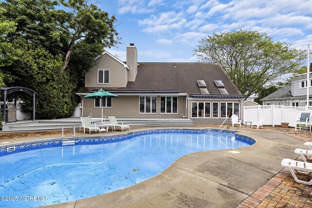 14 W St, Monmouth Beach, NJ 07750 - view of swimming pool featuring a patio and a sunroom
