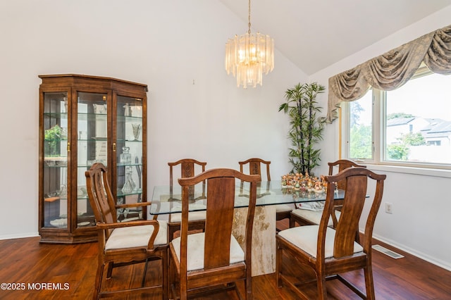 892 Eaglehurst Rd, Toms River, NJ 08753 - dining area with vaulted ceiling, wood finished floors, and a chandelier