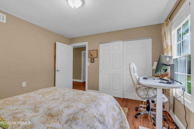 37 Normanton Ave, Manchester, NJ 08759 - bedroom with wood finished floors, a closet, and an office area