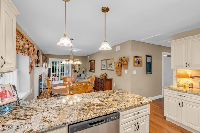 37 Normanton Ave, Manchester, NJ 08759 - kitchen with dishwasher, light wood-style flooring, light stone countertops, and white cabinets