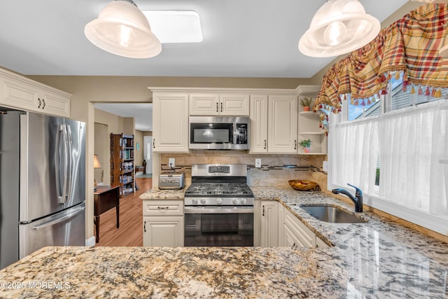 37 Normanton Ave, Manchester, NJ 08759 - kitchen with stainless steel appliances, light stone counters, backsplash, and wood finished floors