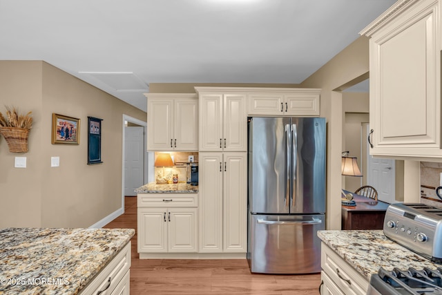 37 Normanton Ave, Manchester, NJ 08759 - kitchen with freestanding refrigerator, light wood-style flooring, backsplash, and light stone counters