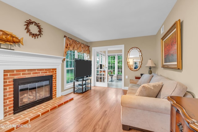 37 Normanton Ave, Manchester, NJ 08759 - living area with light wood-style floors and a brick fireplace