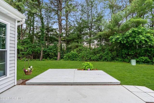 37 Normanton Ave, Manchester, NJ 08759 - view of patio featuring a deck and view of scattered trees