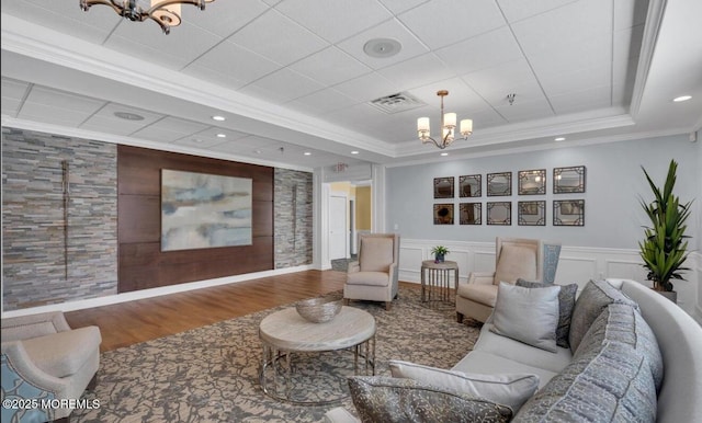 37 Normanton Ave, Manchester, NJ 08759 - living area with a chandelier, a tray ceiling, wainscoting, wood finished floors, and recessed lighting