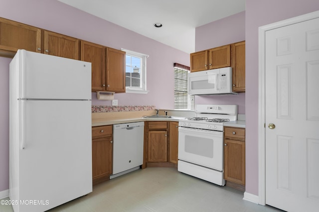 48 Wordsworth Rd, Brick, NJ 08724 - kitchen featuring white appliances, light countertops, brown cabinets, and light floors