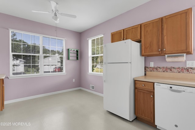 48 Wordsworth Rd, Brick, NJ 08724 - kitchen with white appliances, brown cabinetry, light countertops, and ceiling fan