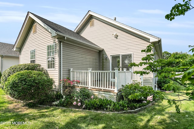 48 Wordsworth Rd, Brick, NJ 08724 - rear view of house with a deck and a lawn