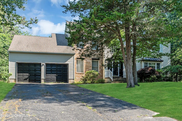 4 W Dickens Ct, Jackson, NJ 08527 - view of front of home with asphalt driveway, an attached garage, a front lawn, and a shingled roof