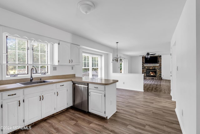 4 W Dickens Ct, Jackson, NJ 08527 - kitchen with dishwasher, a sink, a fireplace, and dark wood-style floors