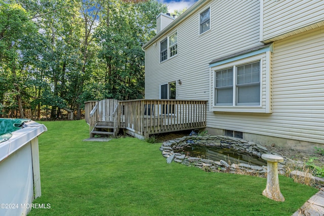 4 W Dickens Ct, Jackson, NJ 08527 - view of grassy yard featuring a deck