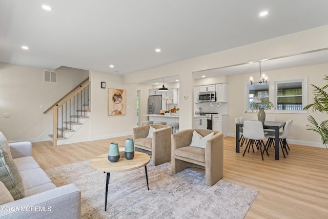 190 Ravenwood Blvd, Barnegat, NJ 08005 - living area featuring light wood-style flooring, stairs, a chandelier, recessed lighting, and baseboards