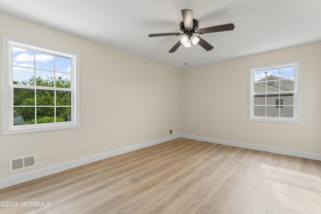 190 Ravenwood Blvd, Barnegat, NJ 08005 - empty room with healthy amount of natural light, light wood-type flooring, and ceiling fan