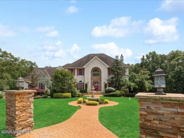 1 Turtle Clan Ct, Clarksburg, NJ 08510 - view of front of home with a front yard and a chimney