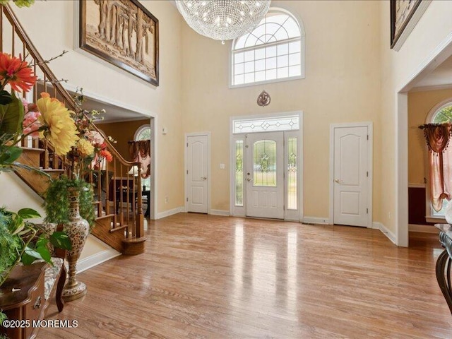 1 Turtle Clan Ct, Clarksburg, NJ 08510 - foyer entrance with stairs, a high ceiling, wood finished floors, and a chandelier