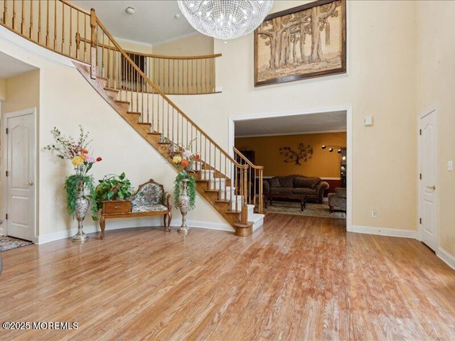 1 Turtle Clan Ct, Clarksburg, NJ 08510 - foyer entrance featuring a high ceiling, stairway, wood finished floors, and a chandelier