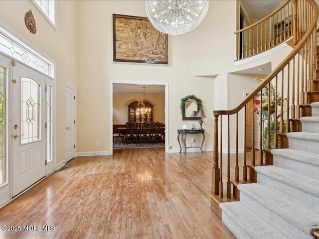 1 Turtle Clan Ct, Clarksburg, NJ 08510 - entryway featuring a chandelier, a high ceiling, stairs, and wood finished floors