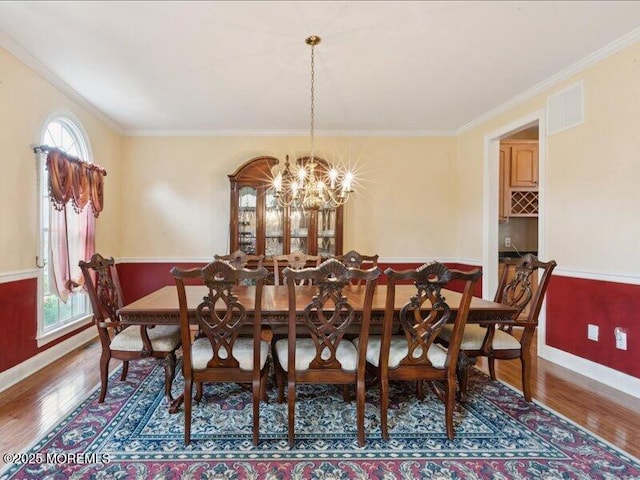 1 Turtle Clan Ct, Clarksburg, NJ 08510 - dining area with wood finished floors, ornamental molding, and a chandelier