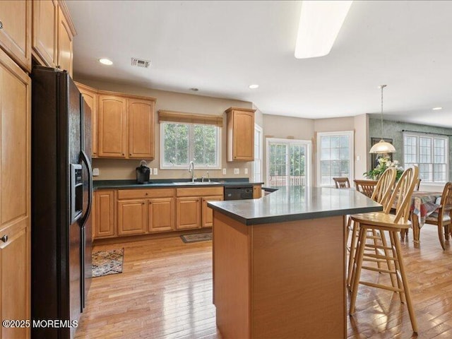 1 Turtle Clan Ct, Clarksburg, NJ 08510 - kitchen featuring black appliances, a kitchen breakfast bar, light wood finished floors, dark countertops, and recessed lighting