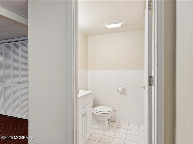 1 Turtle Clan Ct, Clarksburg, NJ 08510 - bathroom with vanity, tile patterned floors, a wainscoted wall, and tile walls