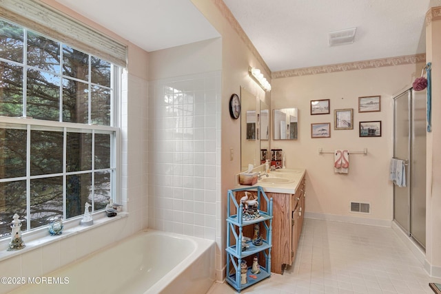 28 Tulip Ct, Howell, NJ 07731 - full bathroom with vanity, a bath, a shower stall, tile patterned floors, and baseboards