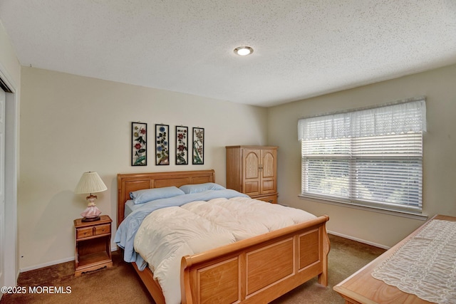 28 Tulip Ct, Howell, NJ 07731 - carpeted bedroom featuring baseboards, a closet, and a textured ceiling