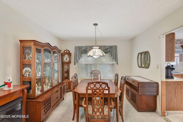 28 Tulip Ct, Howell, NJ 07731 - dining area featuring light tile patterned flooring, a textured ceiling, and a chandelier