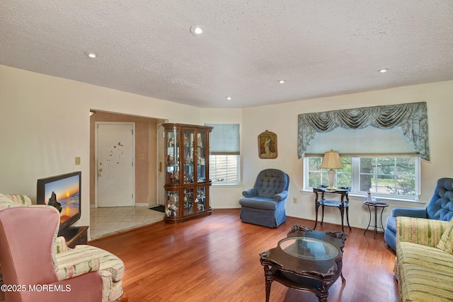 28 Tulip Ct, Howell, NJ 07731 - living area with wood finished floors, a textured ceiling, and recessed lighting