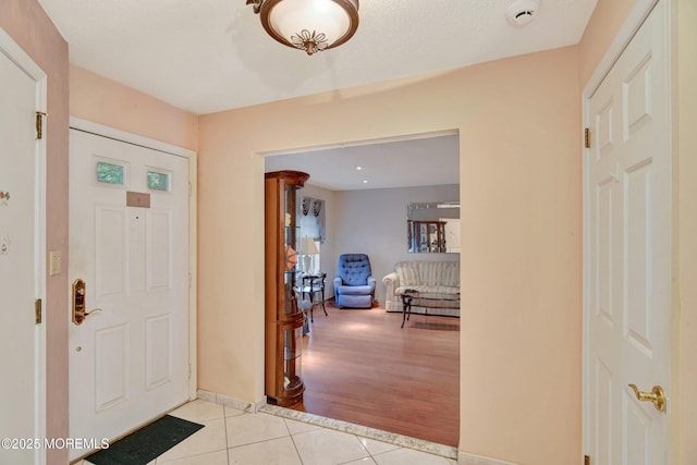 28 Tulip Ct, Howell, NJ 07731 - foyer entrance with light tile patterned floors and baseboards