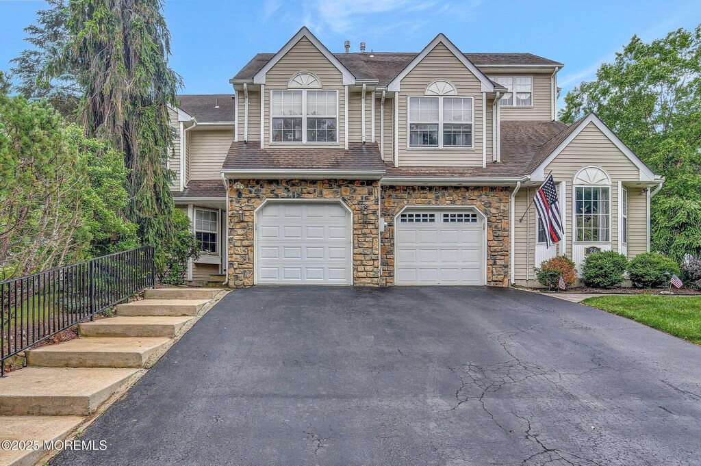 28 Tulip Ct, Howell, NJ 07731 - multi unit property with driveway, an attached garage, stone siding, and a shingled roof