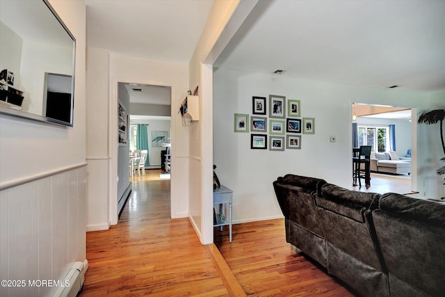 855 Derry Dr, Toms River, NJ 08753 - hallway with light wood-style floors and a baseboard radiator