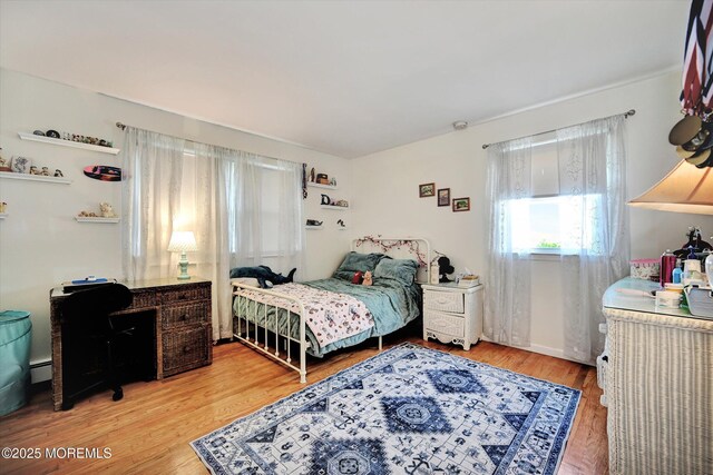 855 Derry Dr, Toms River, NJ 08753 - bedroom featuring baseboard heating and light wood finished floors