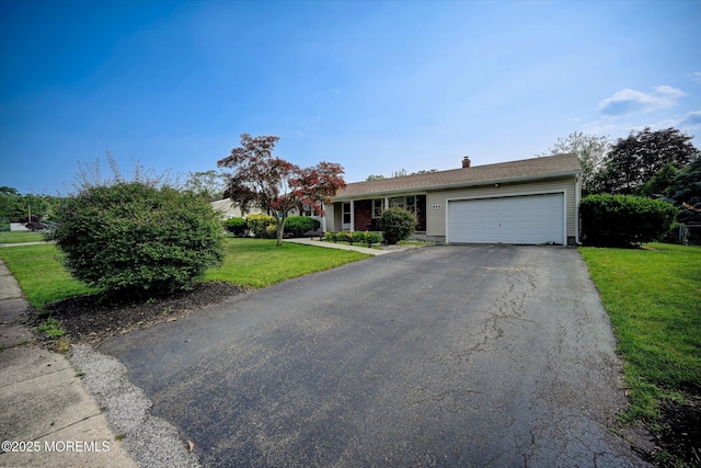 855 Derry Dr, Toms River, NJ 08753 - view of front of home featuring asphalt driveway, a garage, a chimney, and a front lawn