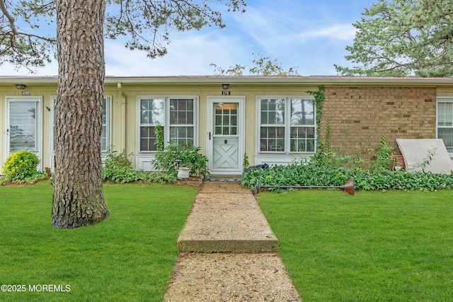 17E Cambridge Cir, Manchester, NJ 08759 - view of front of home with a front lawn and brick siding