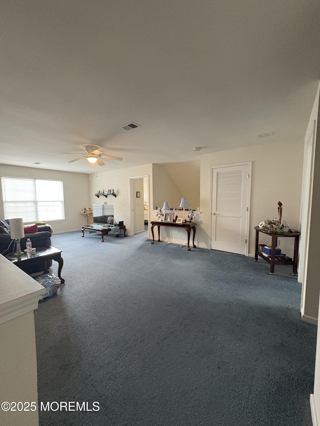 48 Marigold Ln, Little Egg Harbor, NJ 08087 - living room with dark colored carpet and a ceiling fan
