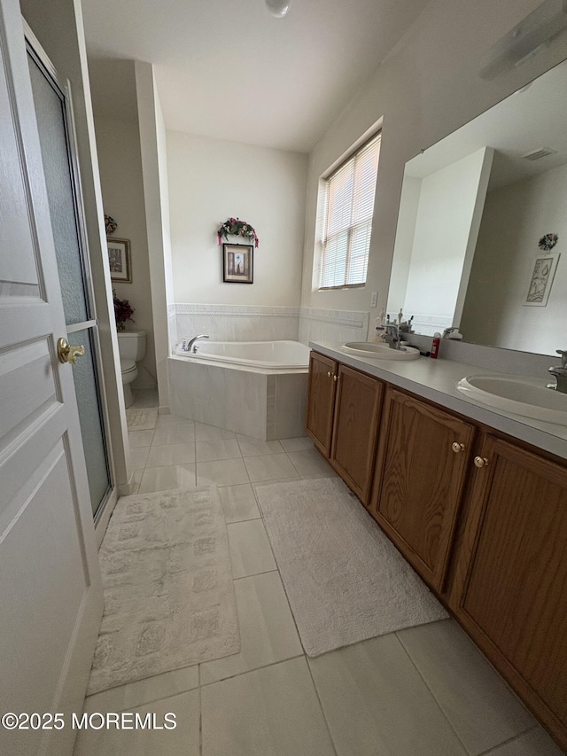 48 Marigold Ln, Little Egg Harbor, NJ 08087 - bathroom featuring tile patterned flooring, double vanity, and a garden tub