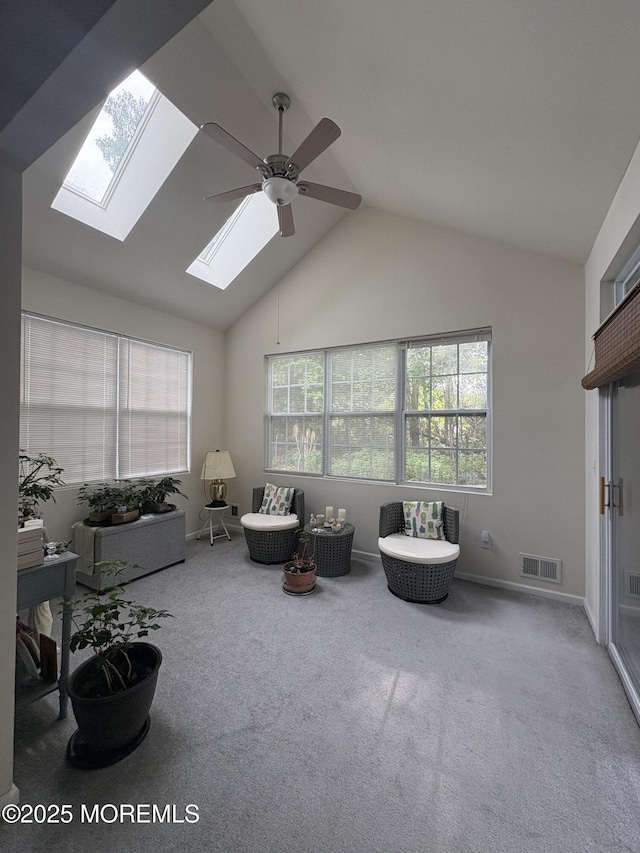 48 Marigold Ln, Little Egg Harbor, NJ 08087 - carpeted living room with ceiling fan, a skylight, and vaulted ceiling