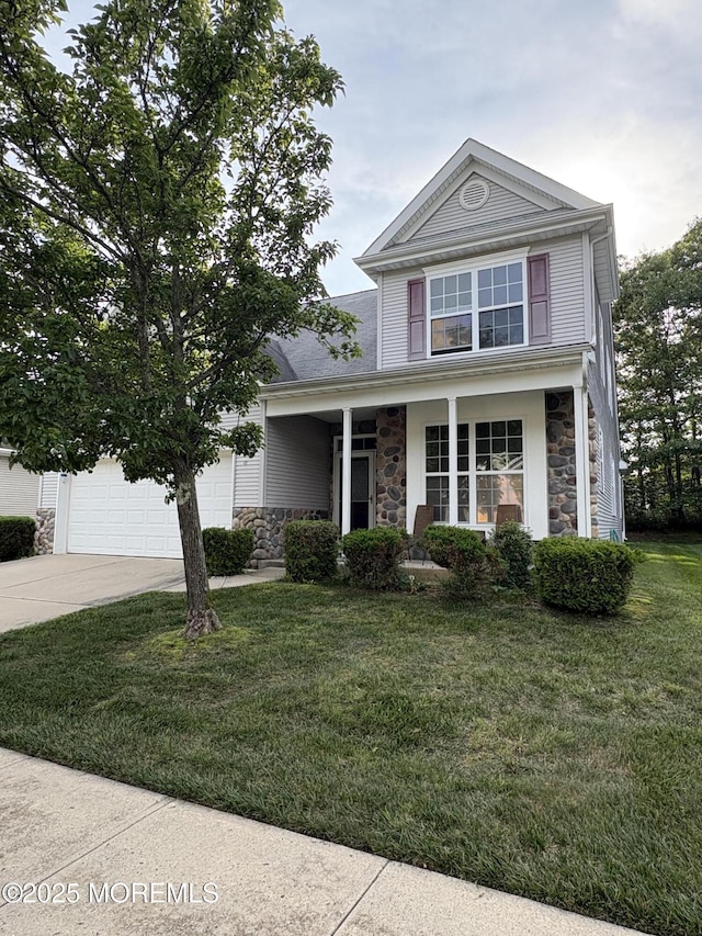 48 Marigold Ln, Little Egg Harbor, NJ 08087 - view of front of home featuring stone siding, driveway, a front lawn, a garage, and a porch