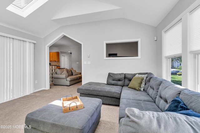 6 Hoffer Ct, Marlboro, NJ 07746 - carpeted living room with vaulted ceiling and a skylight
