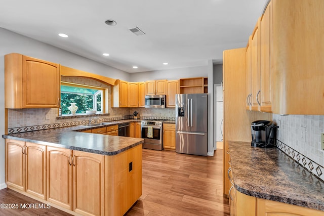 6 Hoffer Ct, Marlboro, NJ 07746 - kitchen featuring appliances with stainless steel finishes, open shelves, a peninsula, dark countertops, and light wood-style flooring