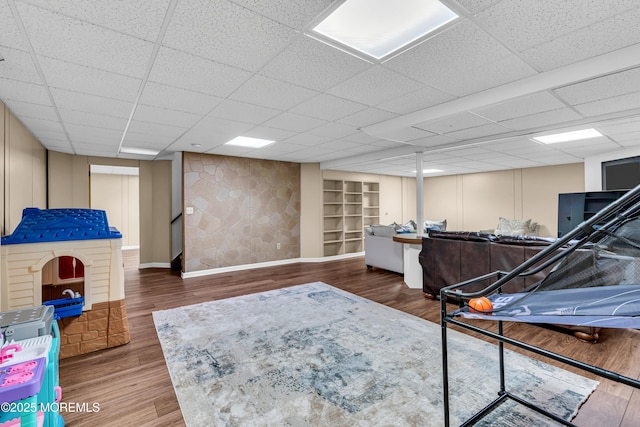 6 Hoffer Ct, Marlboro, NJ 07746 - playroom with wood finished floors and a paneled ceiling